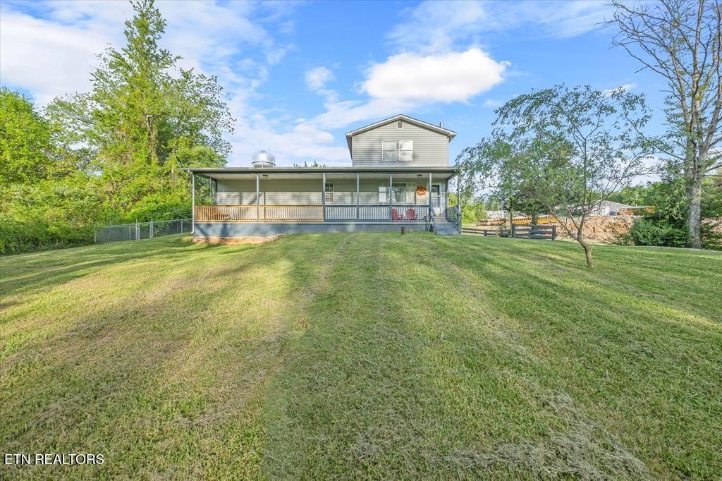 518 Flatt Spur Road Jamestown, TN 38556 - Photo 2 of 30 a view of a big house with a big yard and large trees
