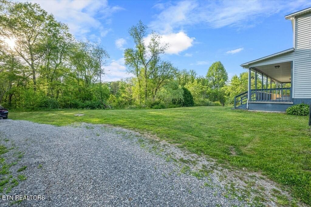 518 Flatt Spur Road Jamestown, TN 38556 - Photo 7 of 30 a view of a house with a backyard