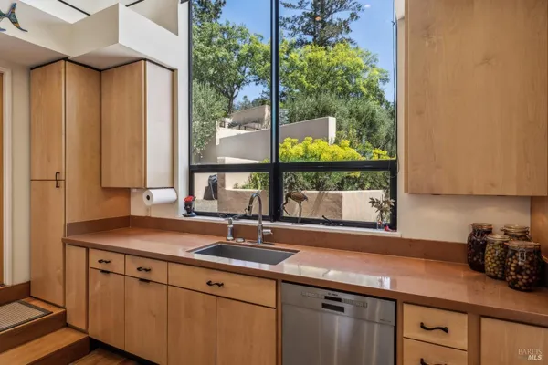 a kitchen with a table chairs and a refrigerator