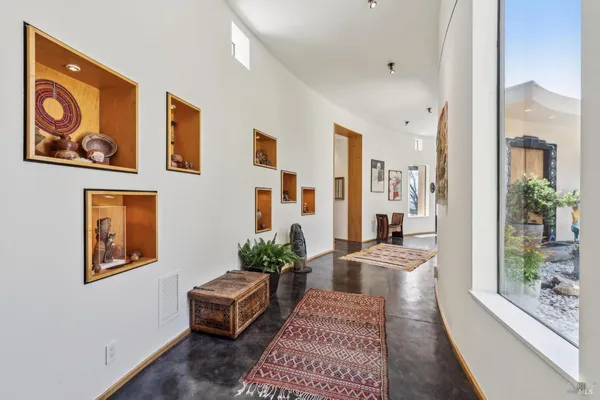 a bedroom with a bed and a book shelf