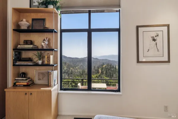 a living room with furniture cabinets and a flat screen tv