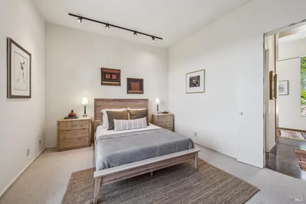 a bedroom with a bed and a fireplace