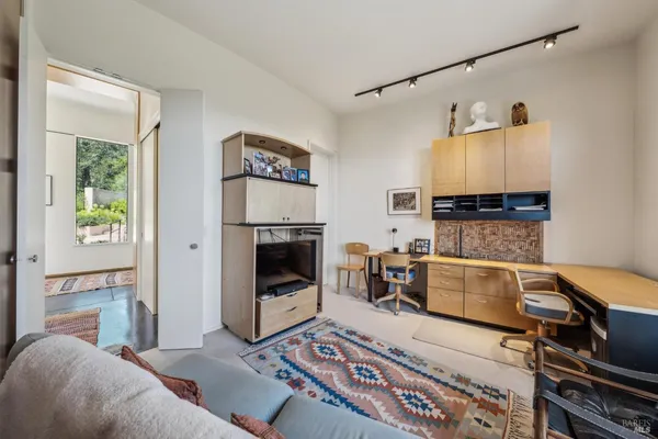 a living room with a fireplace and a fireplace