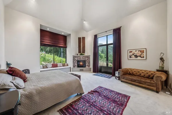 a view of a mountain range with a lush green forest