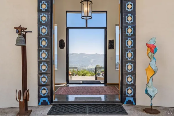 a view of a balcony with a table and chairs