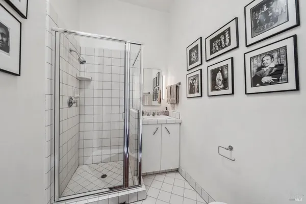 a view of a balcony with couches and wooden floor