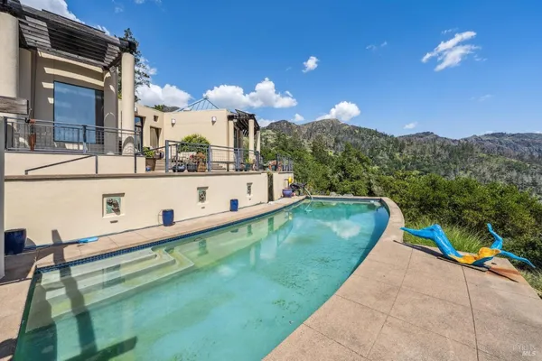 a bathroom with a sink vanity mirror and a toilet