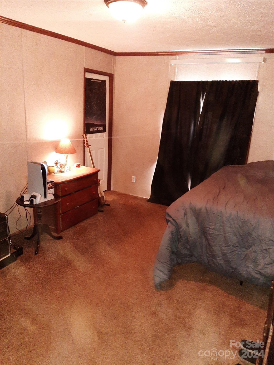 5059 Cabal Road Sharon, SC 29742 - Photo 22 of 36 a bedroom with a bed and a mirror
