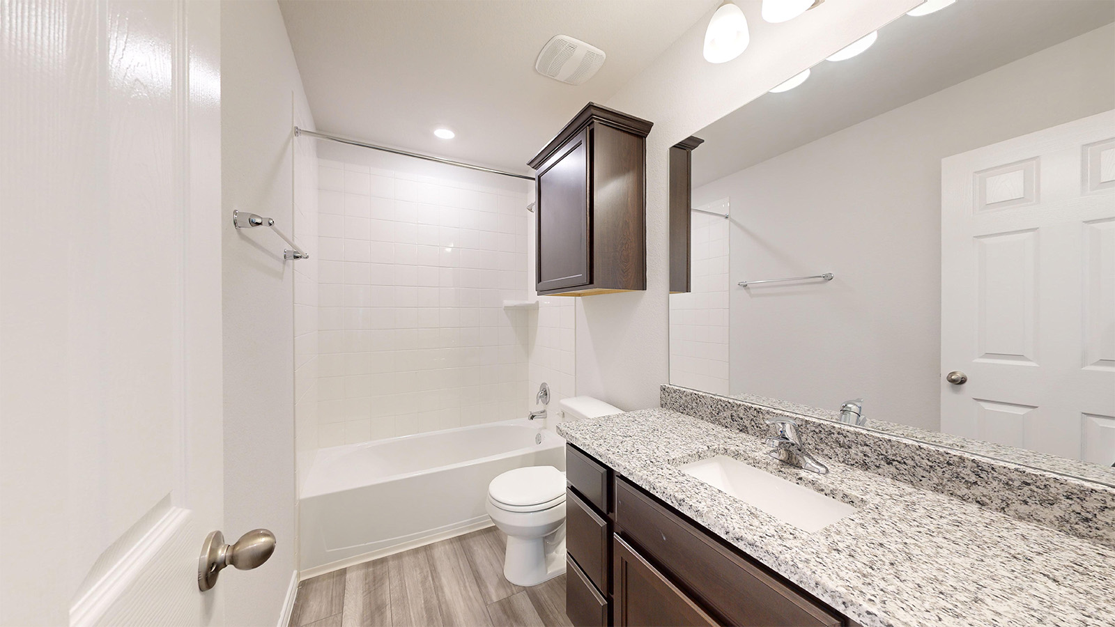 408 Creekfall Road Burnet, TX 78611 - Photo 19 of 21 a bathroom with a granite countertop sink toilet and shower