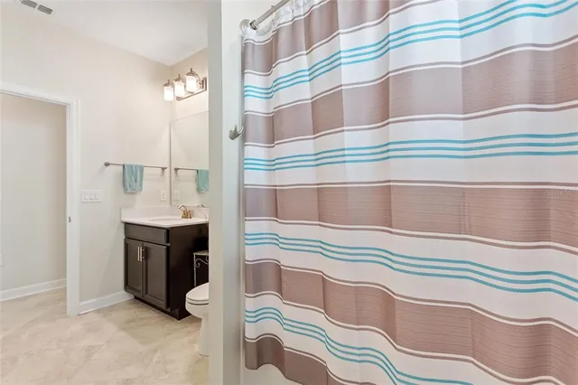 a bathroom with a sink double vanity and a mirror