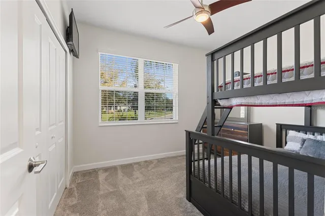 a dining room with furniture and chandelier