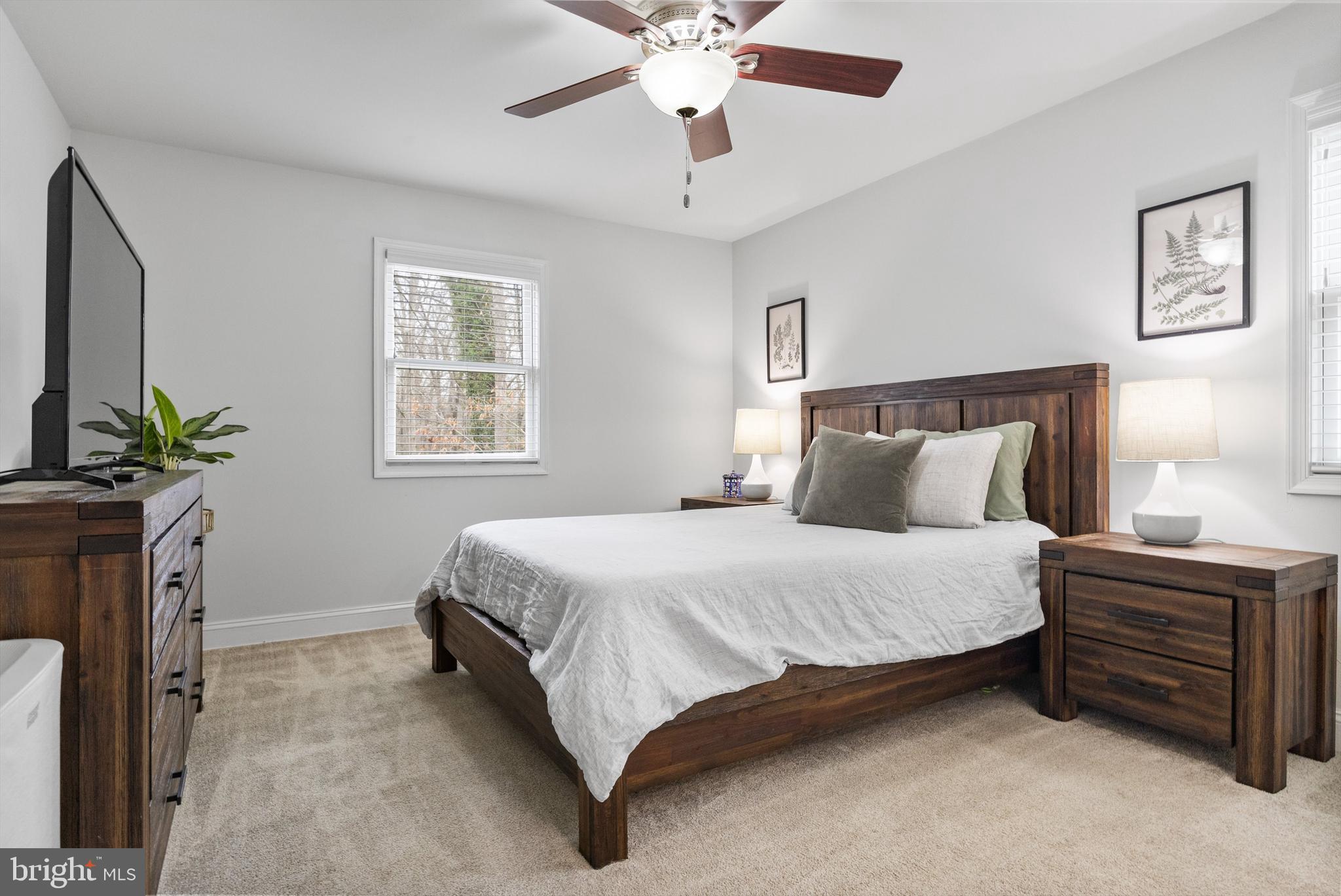13 Mallard Drive Tabernacle, NJ 08088 - Photo 20 of 54 a bedroom with a bed and a chandelier