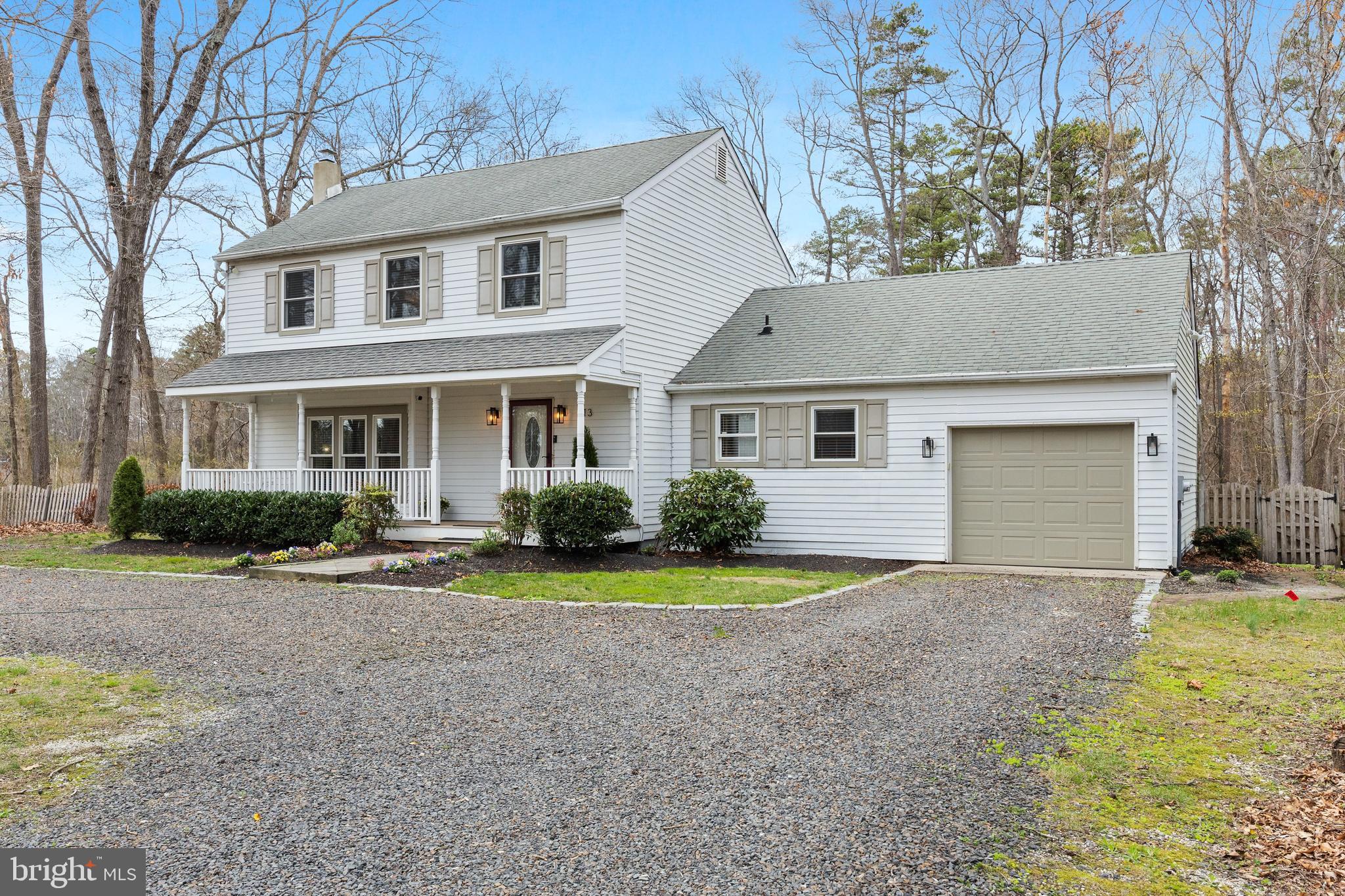 13 Mallard Drive Tabernacle, NJ 08088 - Photo 2 of 54 a front view of a house with a yard and garage