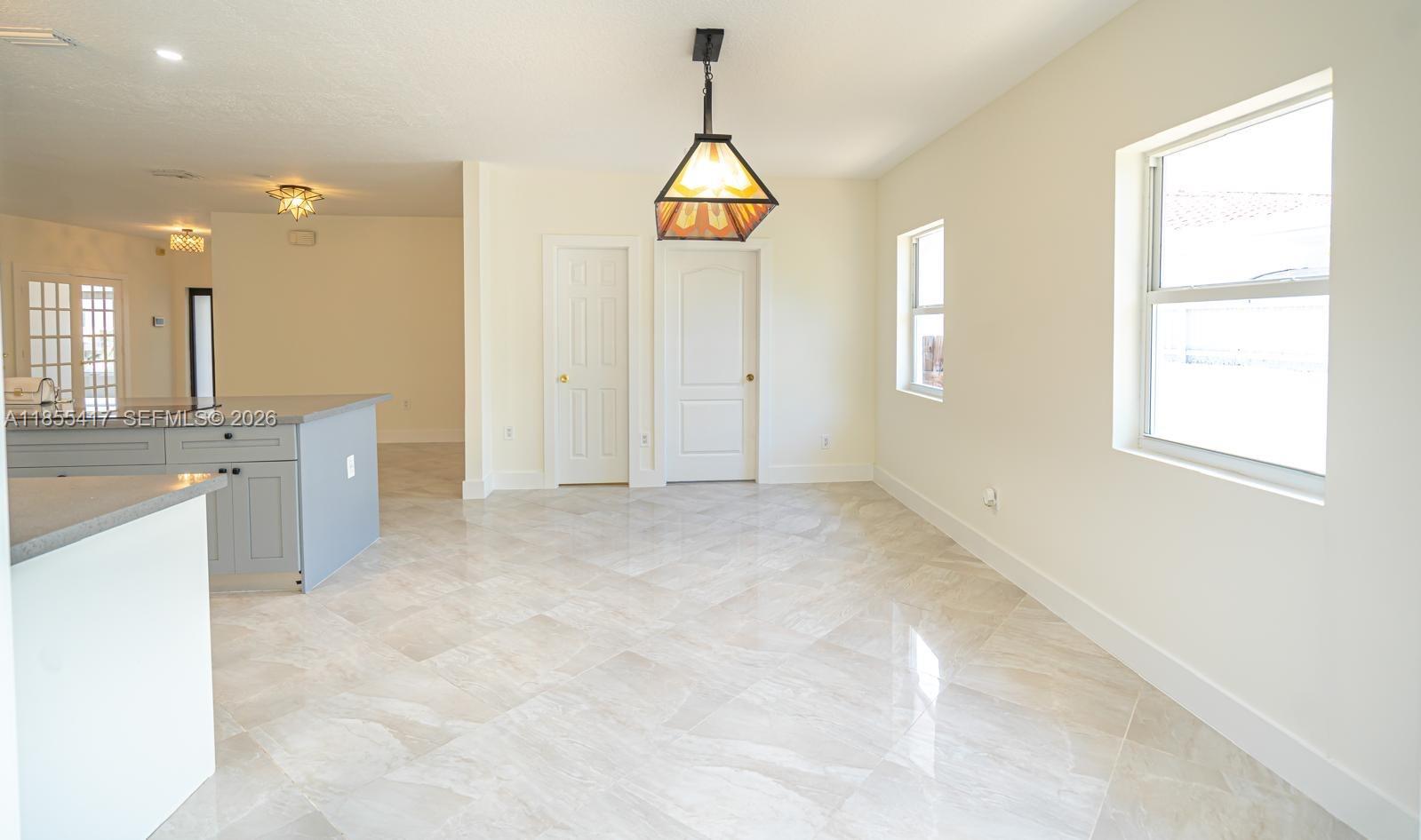 2810 Southwest 114th Avenue Miami, FL 33165 - Photo 18 of 62 a view of an empty room with window and mirror