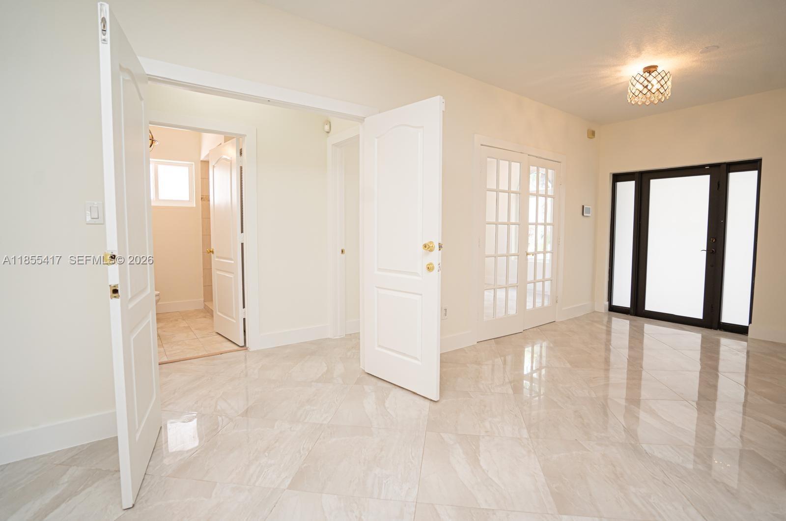 2810 Southwest 114th Avenue Miami, FL 33165 - Photo 39 of 62 a view of an empty room with a window