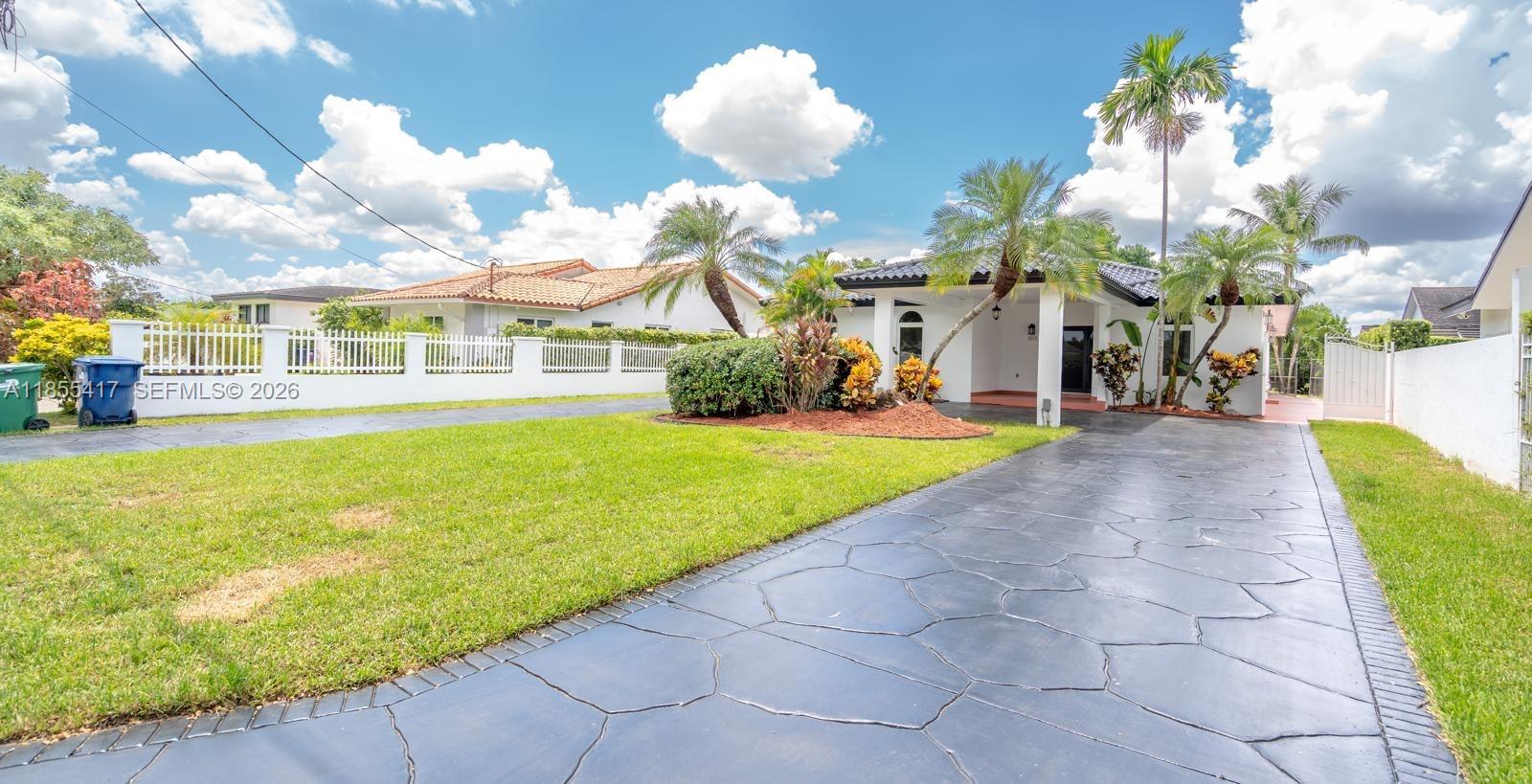 2810 Southwest 114th Avenue Miami, FL 33165 - Photo 4 of 62 a view of a house with a yard and potted plants