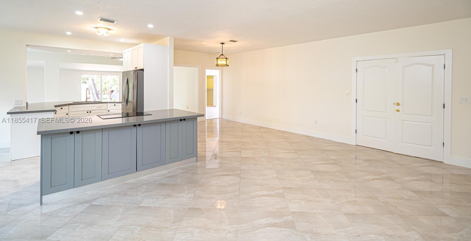 2810 Southwest 114th Avenue Miami, FL 33165 - Photo 45 of 62 a view of a kitchen with kitchen island a sink stainless steel appliances and cabinets