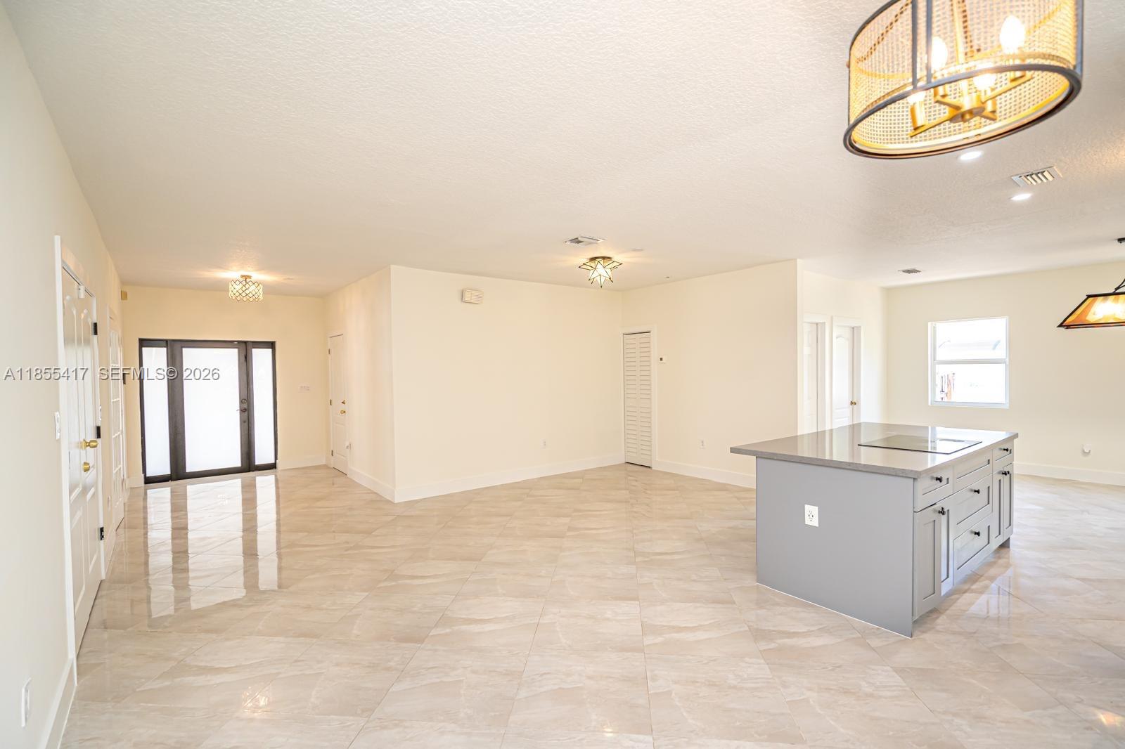 2810 Southwest 114th Avenue Miami, FL 33165 - Photo 10 of 62 a kitchen with stainless steel appliances granite countertop a stove and a refrigerator