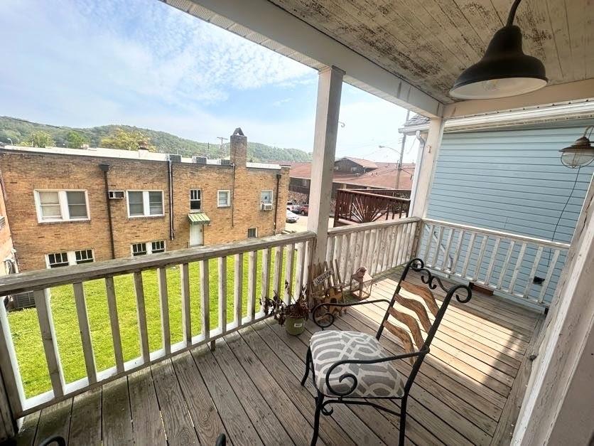 a view of a balcony with chairs
