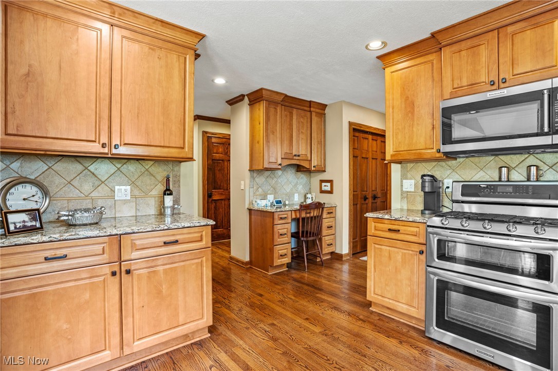 1232 Ashwood Road Akron, OH 44312 - Photo 22 of 50 Kitchen featuring appliances with stainless steel finishes, dark wood-type flooring, Quartz counters, and recessed lighting