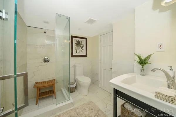 a bathroom with a sink and toilet