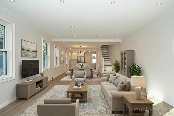 a living room with fireplace furniture and a flat screen tv