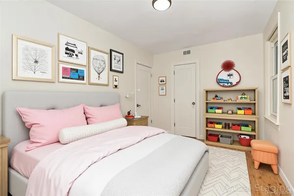 a bedroom with a bed and book shelf