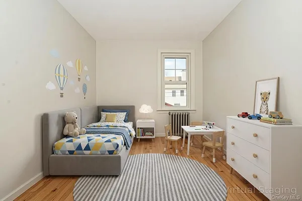 a bed room with a bed window and a dresser