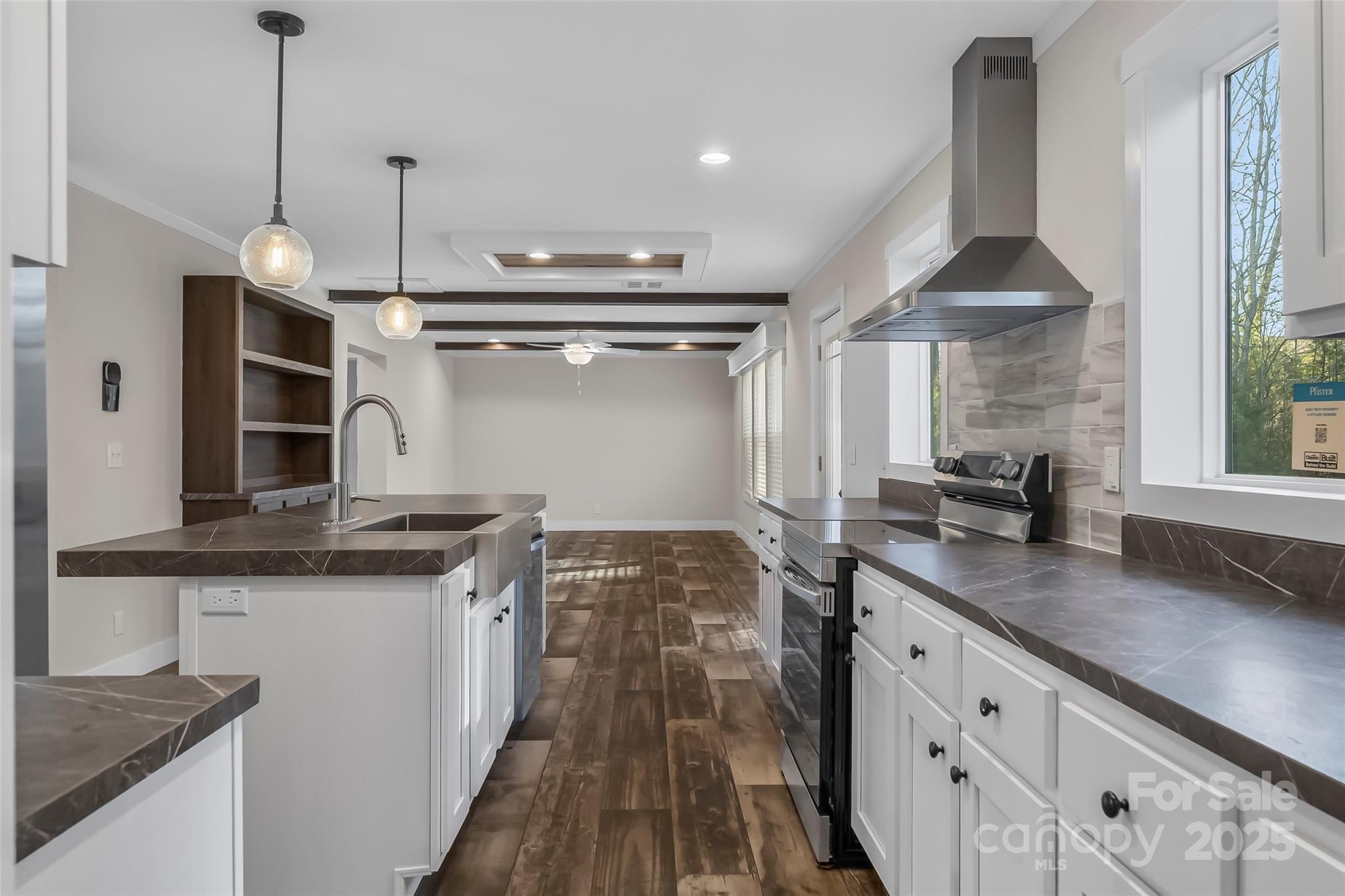 209 Walnut Br Road Weaverville, NC 28787 - Photo 12 of 43 a kitchen with granite countertop a sink stainless steel appliances and cabinets