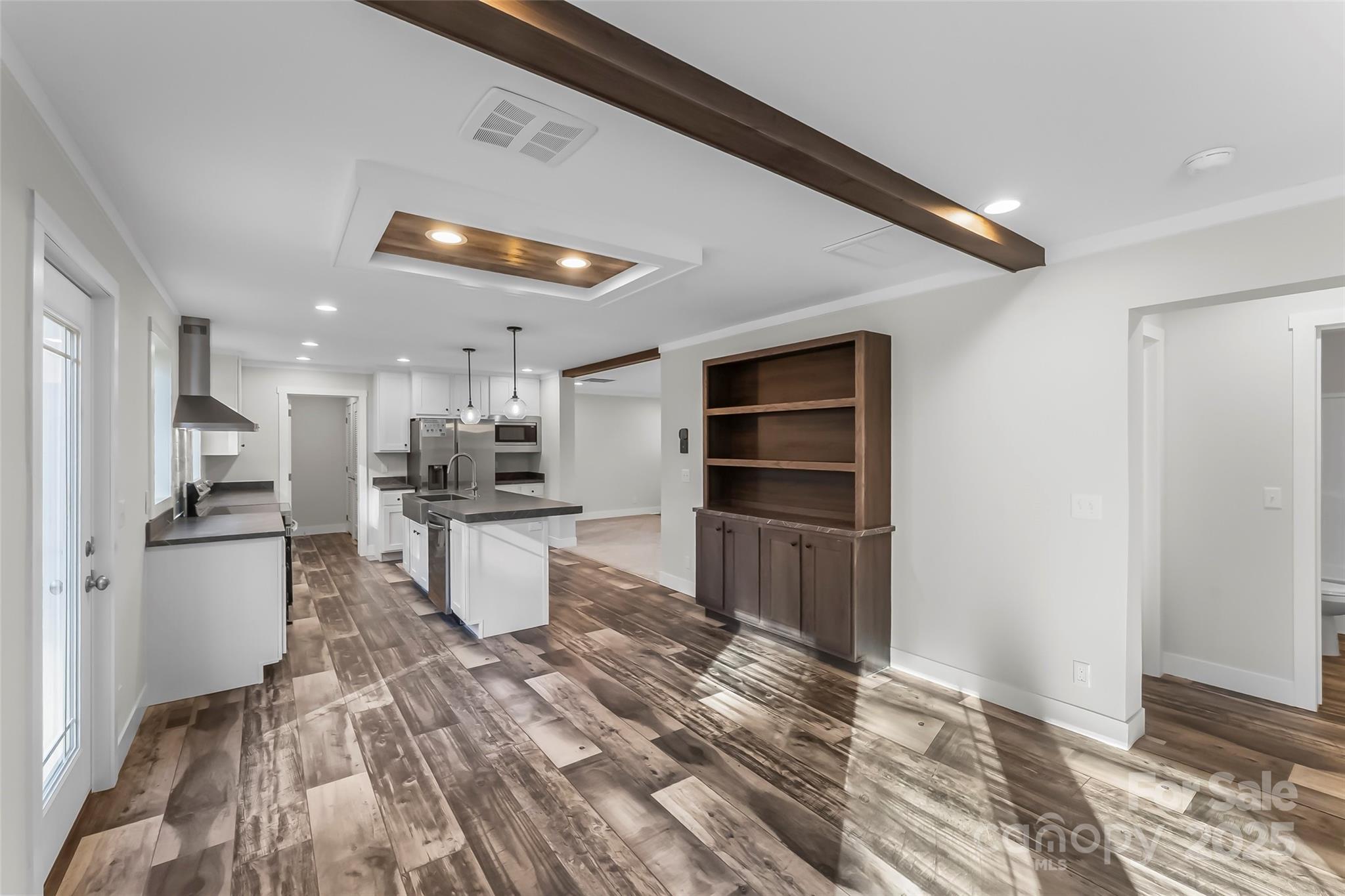 209 Walnut Br Road Weaverville, NC 28787 - Photo 17 of 43 a kitchen with a refrigerator and a stove top oven