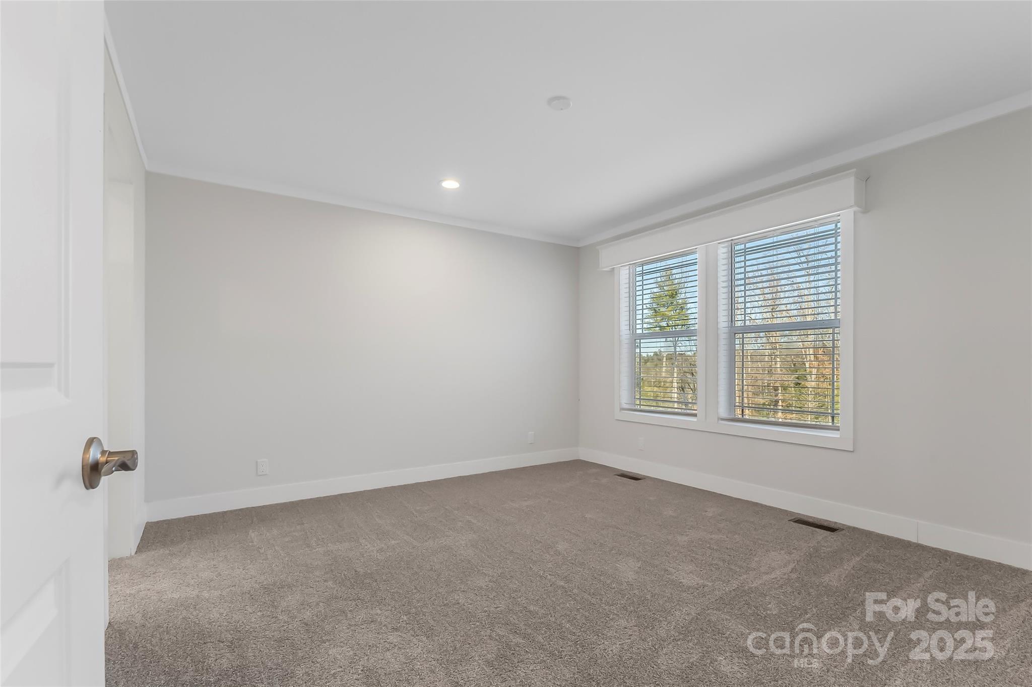 209 Walnut Br Road Weaverville, NC 28787 - Photo 18 of 43 an empty room with a window
