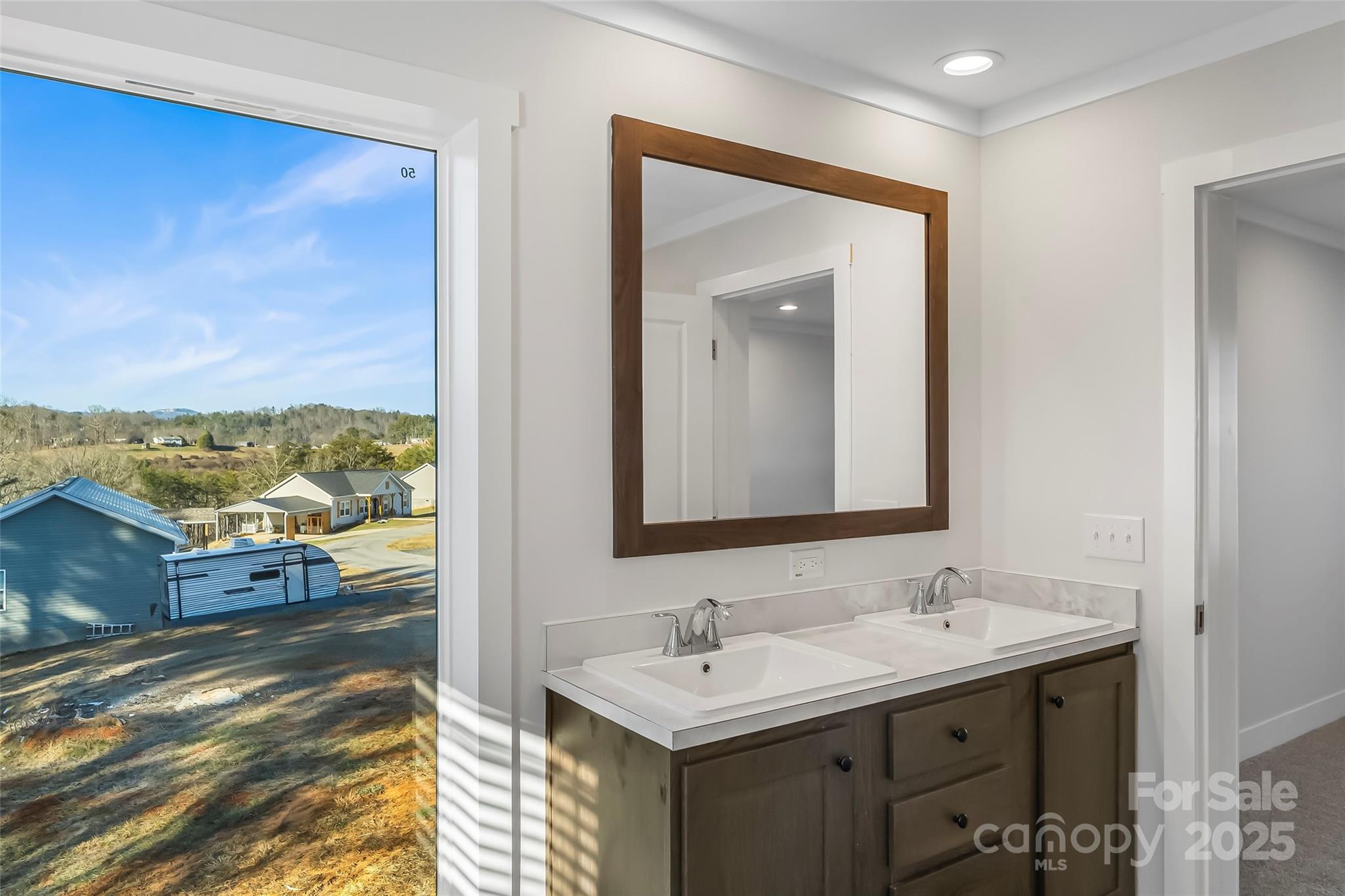 209 Walnut Br Road Weaverville, NC 28787 - Photo 22 of 43 a bathroom with a sink and a mirror