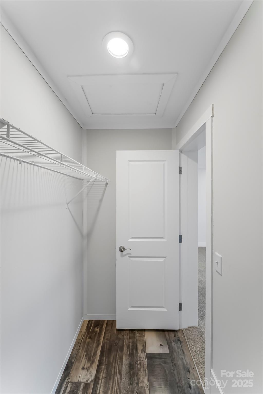 209 Walnut Br Road Weaverville, NC 28787 - Photo 26 of 43 a view of walk in closet with wooden floor