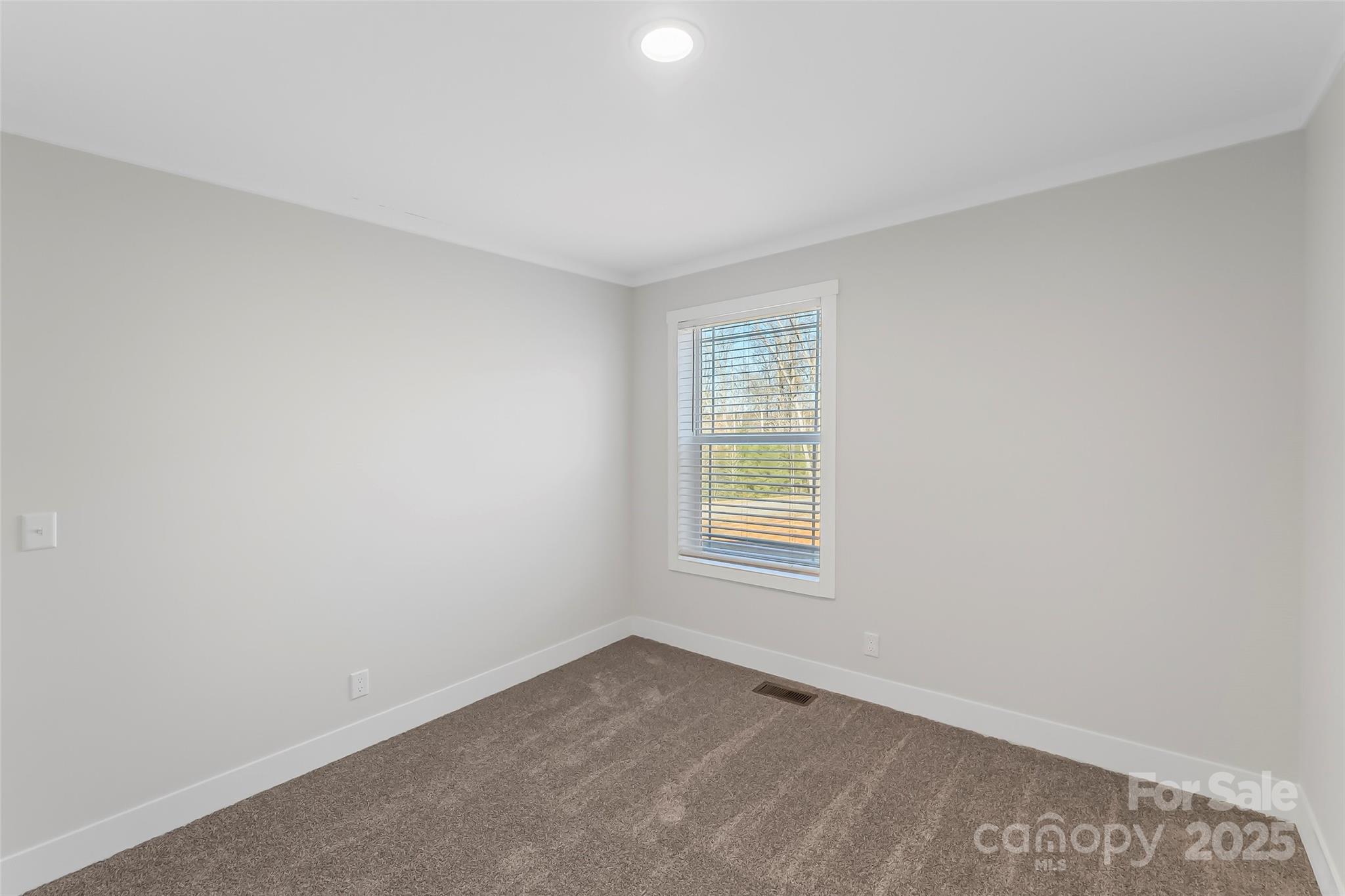 209 Walnut Br Road Weaverville, NC 28787 - Photo 27 of 43 an empty room with a window