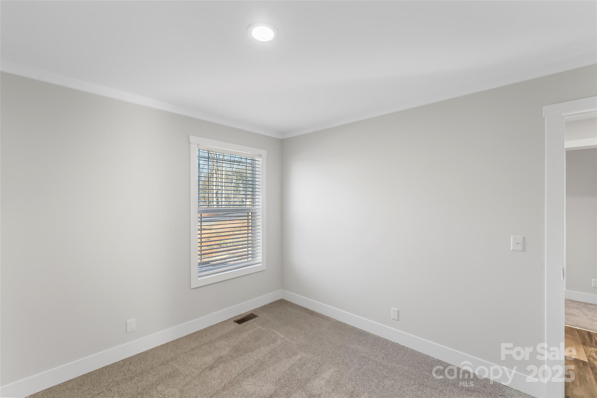 209 Walnut Br Road Weaverville, NC 28787 - Photo 32 of 43 a view of an empty room with a window