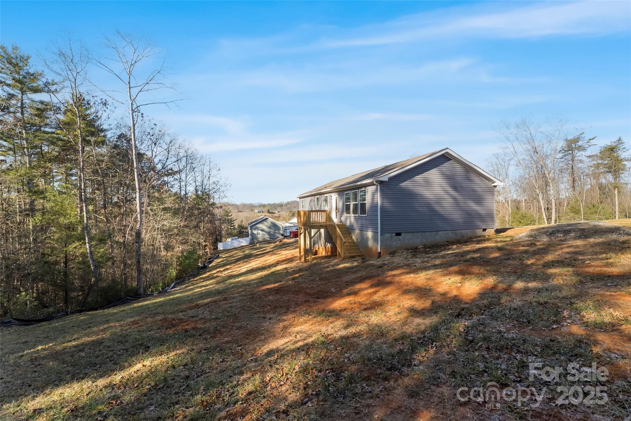 209 Walnut Br Road Weaverville, NC 28787 - Photo 34 of 43 a view of a yard with wooden fence