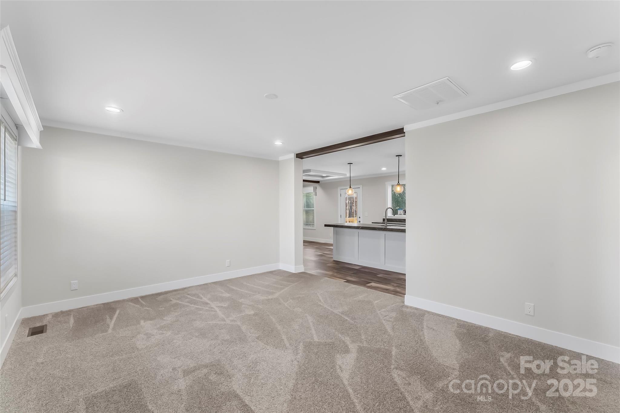 209 Walnut Br Road Weaverville, NC 28787 - Photo 4 of 43 a view of a kitchen with a sink and a refrigerator