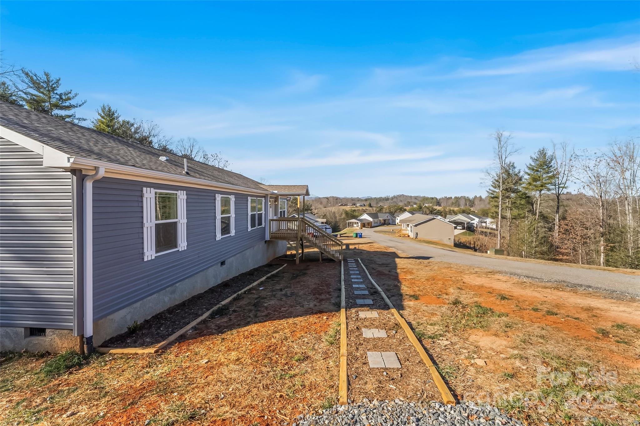 209 Walnut Br Road Weaverville, NC 28787 - Photo 43 of 43 a view of a house with a yard