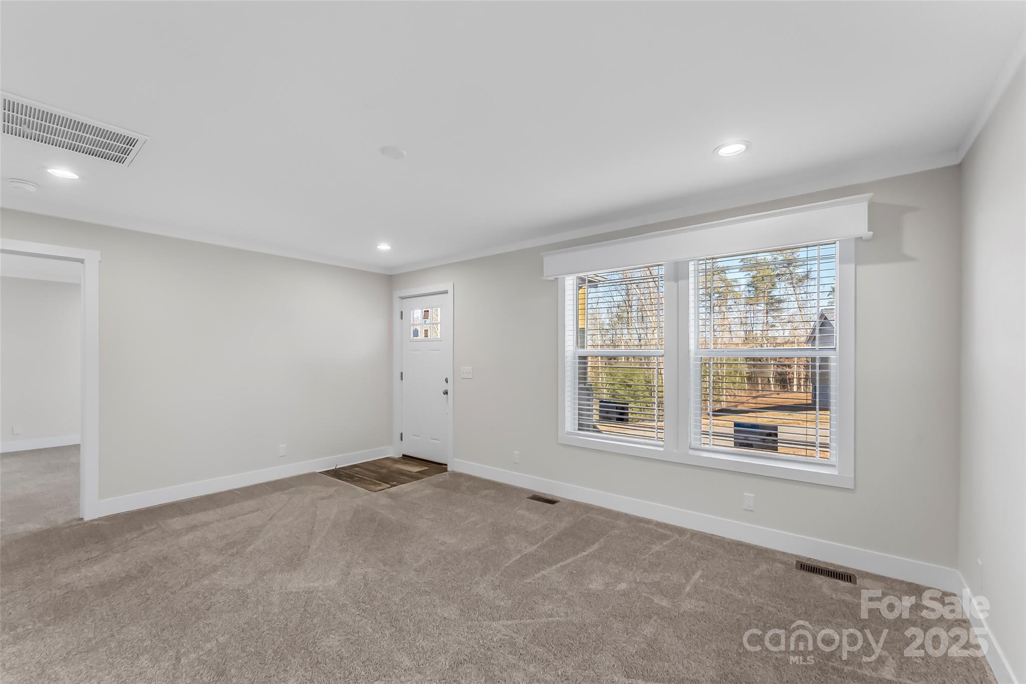 209 Walnut Br Road Weaverville, NC 28787 - Photo 5 of 43 a view of an empty room with a window