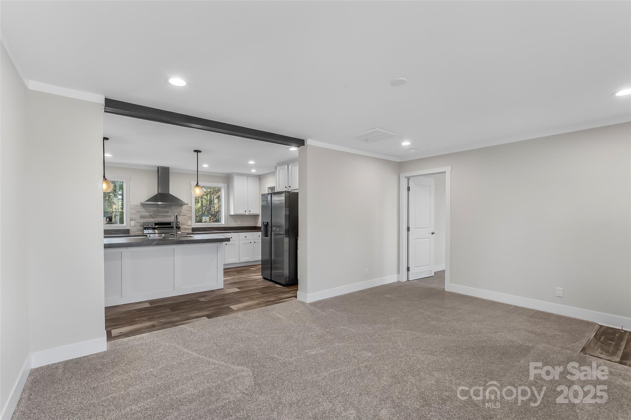 209 Walnut Br Road Weaverville, NC 28787 - Photo 6 of 43 a kitchen with a refrigerator and white counter top