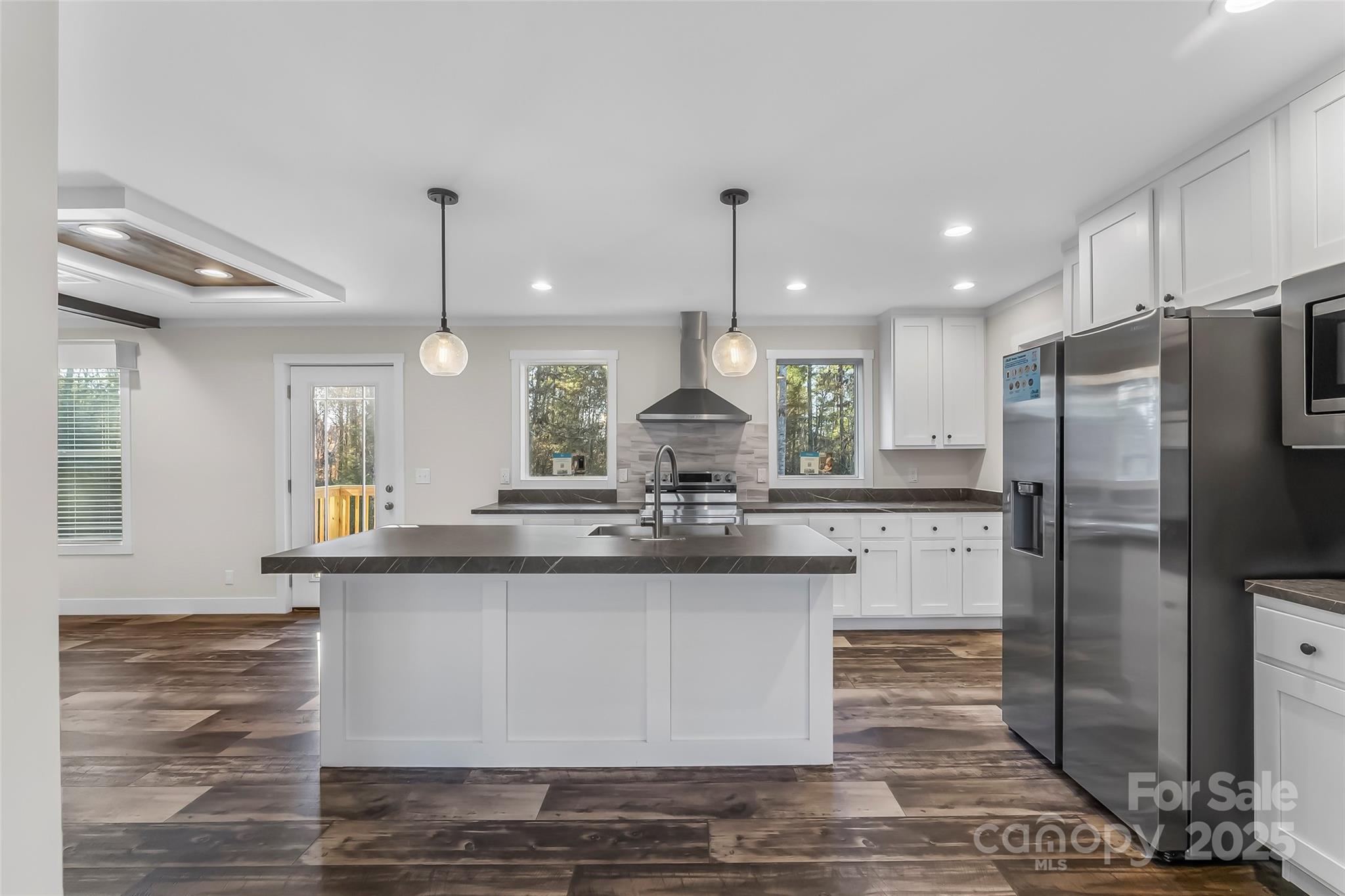 209 Walnut Br Road Weaverville, NC 28787 - Photo 7 of 43 a kitchen with stainless steel appliances granite countertop a sink a stove a refrigerator and island
