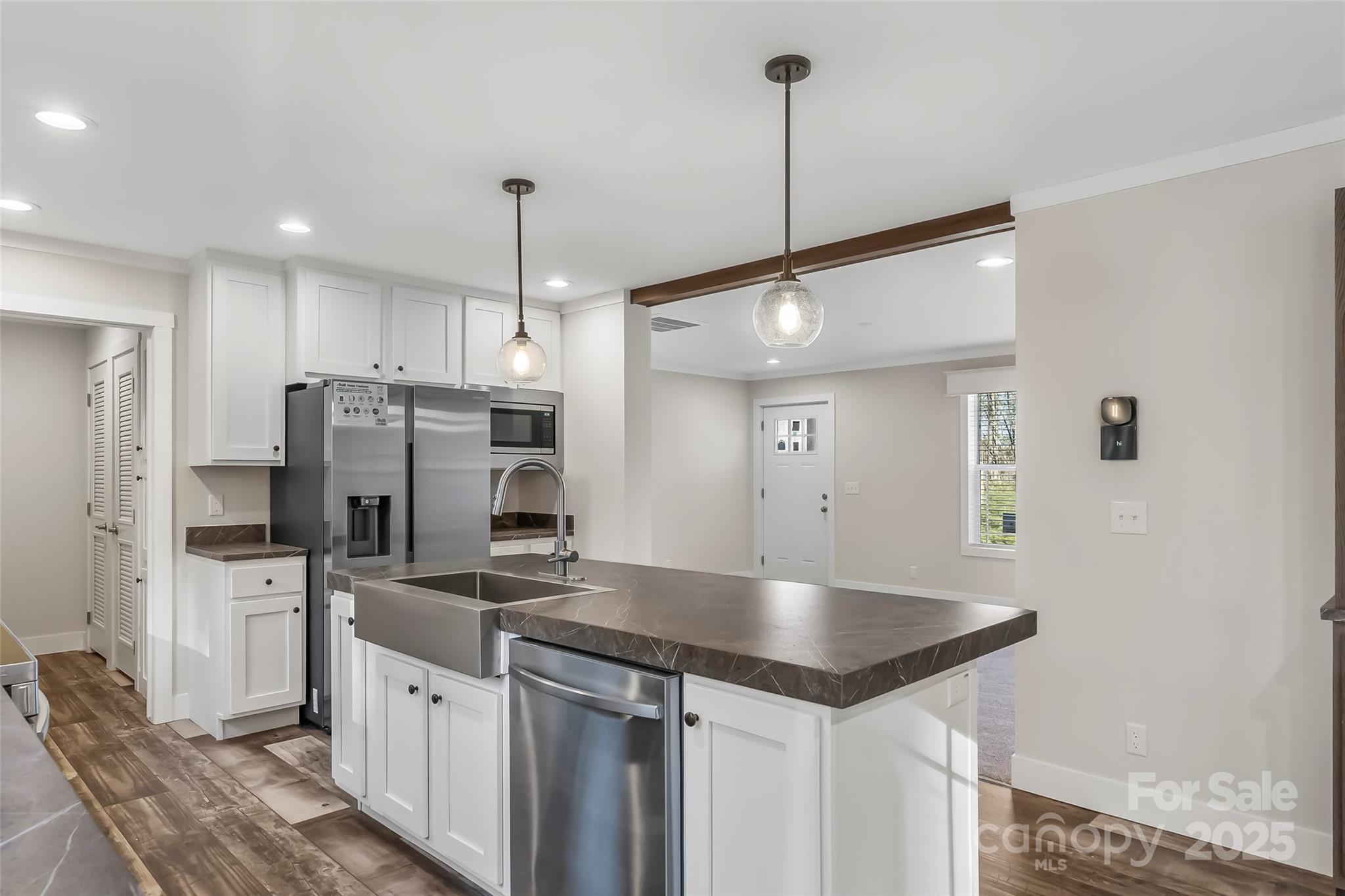 209 Walnut Br Road Weaverville, NC 28787 - Photo 9 of 43 a kitchen with stainless steel appliances granite countertop a sink refrigerator and microwave