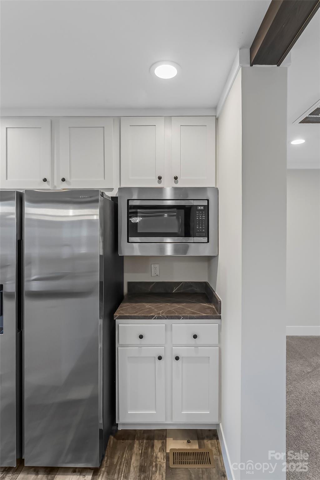 209 Walnut Br Road Weaverville, NC 28787 - Photo 10 of 43 a kitchen with white cabinets and white appliances