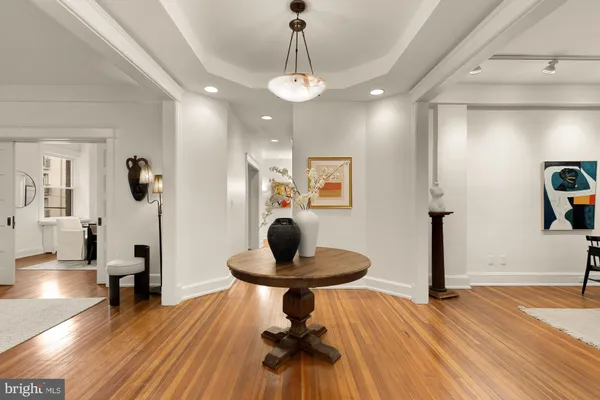 a view of a balcony with wooden floor and fence