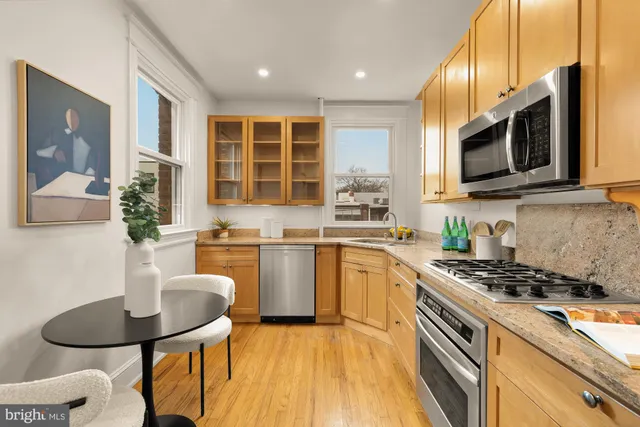 a bedroom with a bed and a potted plant