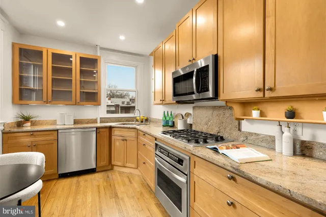 a bedroom with a bed and a potted plant