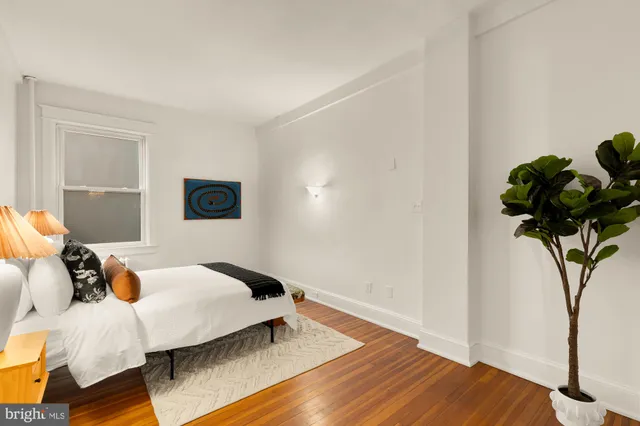 a bathroom with a sink a mirror and a shower