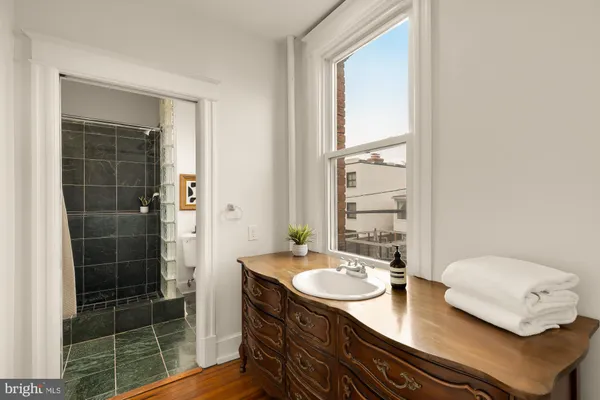 a kitchen with a refrigerator and a sink