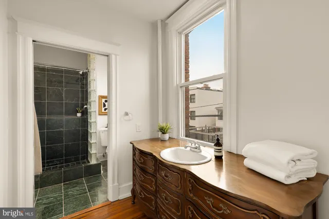 a kitchen with a refrigerator and a sink