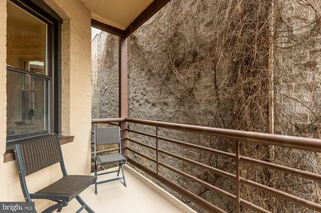 a bedroom with a bed and a potted plant